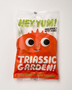 a bag of carrots with googly eyes on the front and bottom, sitting on a white surface