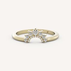 a yellow gold ring with three diamonds on the top, and one diamond in the middle