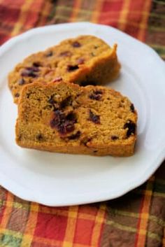 two pieces of cake on a plate with the words cranberry pumpkin apple quick bread