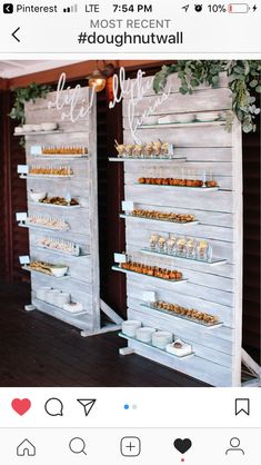 two wooden shelves with desserts on them and the words douhnut wall above them