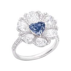 Center Stone: Gia certified natural 1.00ct + Fancy Gray-Blue Matching: 6 white diamonds totaling about 2.48 carats, 77 white diamonds totaling about 0.50 carats, 18K The Smithsonian Institute, which houses the world's three largest blue diamonds (Hope, Blue Heart, and Wittelsbach-Gra), estimates that the odds of finding a blue-colored diamond are only 1 in 200,000; The average production of blue diamonds over one carat is only one, and the annual production of blue diamonds in the world does not Luxury Blue Jewelry With Pave Setting, Emilio Jewelry, Blue Diamond Rings, Blue Heart Ring, Heart Diamond Ring, Argentium Silver Jewelry, Heart Shaped Ring, Blue Diamond Ring, Blue Diamonds