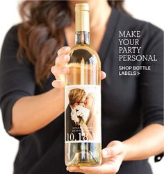 a woman holding a bottle of wine with the label on it that says make your party personal