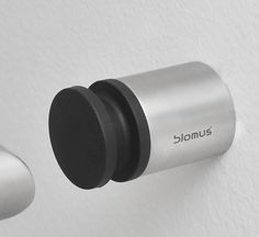 two round knobs are attached to the wall