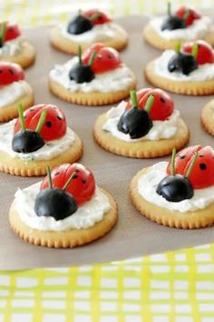 ladybug cookies with whipped cream and cherries on top are ready to be eaten