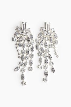 Earrings in metal with a detailed stud at top and rhinestone-chain pendants in different designs and lengths. Height of stud 1/2 in. Interior Textiles, Rhinestone Chain, Room Fragrances, Cardigan Sweater Jacket, Shoe Boot Sandals, Accessories Jewelry Earrings, Metal Earrings, At The Top, Rhinestone Earrings