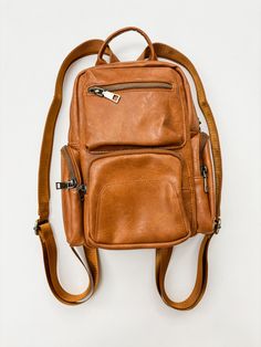 Get ready to elevate your style with the Reese Multi-Way Sling/Backpack! Available in both camel and black, this versatile bag boasts 9 spacious pockets for all your essentials. Stay on trend while staying organized - this fashionable and useful bag has got you covered. Shoe Gifts, Elevate Your Style, Staying Organized, Black Backpack, Sling Backpack, Dress Accessories, Get Ready, Your Style, Camel