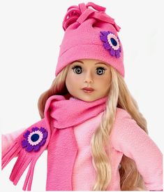 a doll with blonde hair wearing a pink coat and scarf, hat and eyeliners