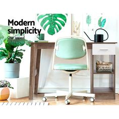 an office chair sitting in front of a desk with potted plants on the side