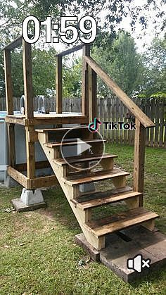 an image of a wooden staircase being built in the yard with text overlaying it