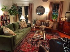 a living room filled with furniture and lots of windows