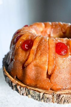 a pineapple bundt cake with cherries on top