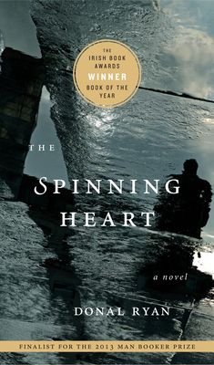 the spinning heart by donna l ryan, with an image of a man standing in water