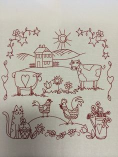 an embroidered sheet with farm animals and flowers