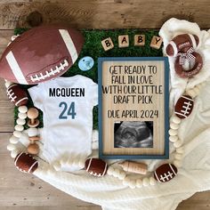 a baby announcement with footballs and other items