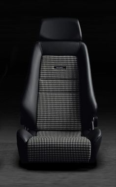 a black and white checkered seat in the dark