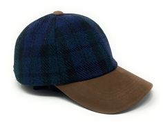 The cap features an adjustable leather strap at the back, allowing for a perfect fit for head sizes from approximately 57cm / 22.5 inch to 64cm / 25.25 in. The fully lined cotton twill interior with an Internal sweatband for added comfort and Harris Tweed label add to the luxurious look and feel of the cap. Looking for a stylish and functional accessory for your next golf or baseball game? Look no further than our 100% Harris Tweed cap, the perfect addition to any sports or casual outfit! Crafte Brown Hat With Curved Visor For Outdoor, Classic Adjustable Baseball Cap For Travel, Adjustable Brown Baseball Cap For Travel, Brown Curved Visor Hat For Outdoor, Classic Blue Baseball Cap For Outdoor, Classic Blue Outdoor Baseball Cap, Fitted Tweed Cap, Tweed Baseball Cap, Adjustable Plaid Cap