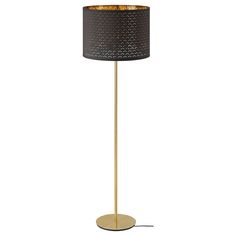 a floor lamp with a black shade on the top and a gold base, in front of a white background