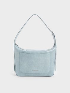 There is something so effortlessly chic about a denim bag, and in particular, a hobo. This Xylia bag in a vinyl denim finish has a lighter wash that makes for an ultra-versatile piece that will complement most outfits. With a boxy and structured silhouette, this bag opens up to a roomy main compartment that will fit your everyday must-haves and more. For added convenience, it also features a front pocket to house your most-used items and keep them within easy reach. Denim Hobo Bag, Charles Keith, Denim Bag, Hobo Bag, Front Pocket, Blue Denim, Vinyl, Handbags, Blue