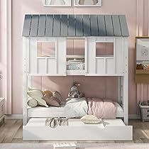 a child's bedroom with a bunk bed and pink walls, white furniture and pictures on the wall