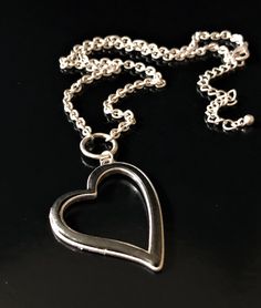 "Custom designed by Alicia's Precious Collection. Handmade with love, in Spring, TX. This Open Heart Black and Silver Stainless Steel Pendant is gorgeous. A must see. 18\" adjustable to 20\" Stainless Steel Silver chain attached. 10% of profits will be donated to Anxiety and Panic Disorder Foundations in and around the Houston Texas area. This is a beautiful necklace with a beautiful cause. XOXO - Alicia Like us on FB at: Alicia's Precious Collection" Open Heart Necklace, Jewelry Black, Protection Bracelet, Stainless Steel Pendant, Open Heart, Beaded Stretch Bracelet, Black Heart, Love Necklace, Black And Silver