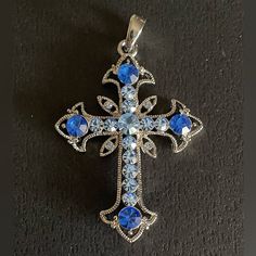 Beautiful Nwot Crystal Cross Featuring Sapphire And Light Sapphire Colored Crystals With Silver Tone. Metal Alloy Chain Will Be Included. Gifts. Cross Necklace. Religious. Spirituality. Whimsigoth. Coquette Girl. Bridal. Bridesmaid. From Smoke Free Dog Friendly Home. Cross With Heart, Coquette Girl, Light Sapphire, Crystal Cross, Sapphire Color, Free Dogs, Color Crystal, Dog Friendly, Blue And Silver