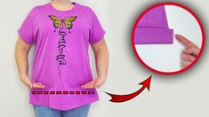 a woman wearing a purple t - shirt with a butterfly on it and an arrow pointing to the left