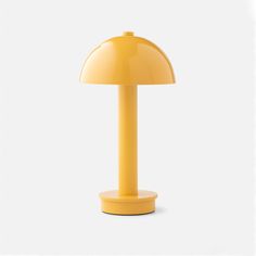 a yellow table lamp on a white background