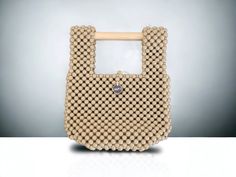 Wood Bead Folding Clutch Handbag Wood Cylinder Handle Dimensions Beige Beaded Shoulder Bag For Daily Use, Beaded Beige Shoulder Bag For Shopping, Beige Beaded Shoulder Bag For Shopping, Beaded Beige Bags For Everyday Use, Beige Beaded Bag For Everyday Use, Everyday Use Beige Beaded Bag, Folding Bag, Wood Wax, Clutch Handbag