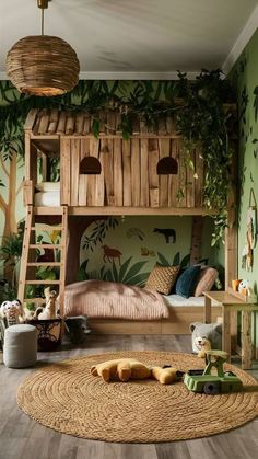 a child's bedroom with a bunk bed and jungle theme on the wall behind it