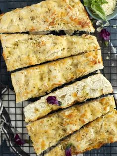 four slices of bread sitting on top of a cooling rack