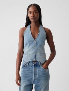 Soft, stretch denim vest.  Halter neckline.  Sleeveless.  Button front.  Smocked, stretch back.  Responsibly Made:  This denim vest is made with 5% recycled cotton and is part of our water-saving Washwell program.  Compared with conventional wash methods, Washwell uses at least 20% less water and has saved over a billion liters of water since 2016.  * Fit: Classic.  A straight & easy fit.  Hits at the hip.  Models wearing Gap Halter Vest, Canadian Tuxedo, Women Shirt Top, Stretch Back, Water Saving, Women's Blouses, Gap Denim, Halter Neckline, Denim Vest