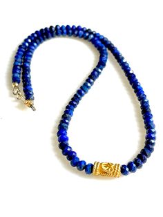 Lapis lazuli gemstone beaded choker with 24k gold vermeil focal and 14k gold fill clasp.  Gorgeous AAA micro faceted 4mm blue lapis rondelles with single 10 x 6mm  gold vermeil tube bead with scroll design.  Dainty beaded choker necklace is made to order with 14k gold fill clasp and findings. Pairs well with other lapis lazuli pieces in shop. Please see last photos above. This listing is for one lapis lazuli choker necklace only. Lapis Lazuli Gemstone, Blue Lapis Lazuli, Jewelry Accessories Ideas, Scroll Design, Blue Lapis, Beaded Choker Necklace, Tube Beads, Beaded Choker, Chain Ring