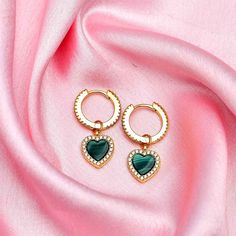 Experience love in a modern and elegant way with our Modern Love Malachite Heart Huggie Hoops. Crafted with 18K gold plating, these heart-shaped huggie hoops add a touch of romance to any outfit. Let these hoops be a reminder of the love that surrounds you. Details: Depth 13mmWidth: 1.5mmHeight: 25mmStone Details: 5mmx5mm Heart Malachite Gold Plated Heart Huggie Earrings For Anniversary, Yellow Gold Heart Huggie Earrings, Elegant Heart Charm Huggie Earrings For Valentine's Day, Valentine's Day Double Heart Huggie Earrings With Heart Charm, Heart-shaped Huggie Earrings With Heart Charm For Valentine's Day, Valentine's Day Heart Shaped Huggie Earrings With Heart Charm, Pearl Birthstone, Stacked Earrings, Gold Vermeil Jewelry