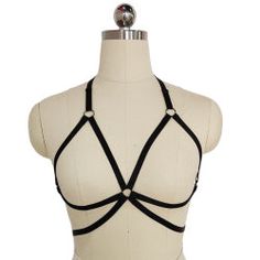 Cage Harness Bra A stunning gothic accessory to structure a sexy outfit around, this beautiful structured cage bra gives you great shape and a stylish silhouette. Experiment with layering under or over clothing, the possibilities are endless! One adjustable size: fits Bust up to 47.5"/120cm and Waist up to 37"/94cm. Fitted Strappy Bra With Multiple Straps, Fitted Multiple Straps Strappy Bra, Dark Costumes, Garter Black, Harness Bra, Gothic Accessories, Body Harness, Black Belt, Diy Clothes