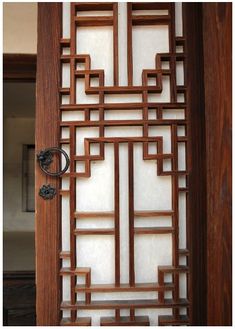 a wooden door with an intricate design on it