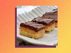 two pieces of cake sitting on top of a white plate