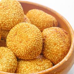 a bowl filled with sesame seeds on top of a table