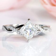 an engagement ring with a princess cut diamond