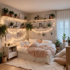 a bedroom with lights and plants on the wall above the bed, along with other decorations