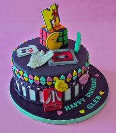 a birthday cake that is decorated with various items