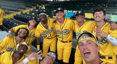 some baseball players are posing for a photo