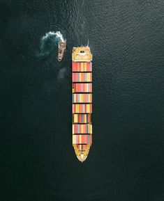 an aerial view of a cargo ship in the ocean