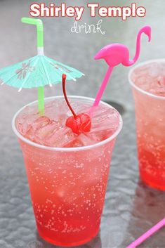 two glasses filled with pink and green drinks