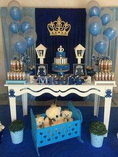 a blue and white dessert table with teddy bears