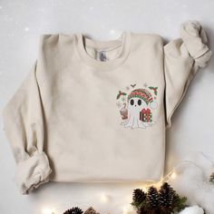 Christmas Cute Ghost Embroidered Sweatshirt Christmas Sweatshirt Cute Ghost Coffee Sweatshirt Christmas Ghost Tees Holiday Sweater Xmas Gift ✨ PRODUCT INFORMATION: 🌱 Material: 65% cotton, 35% polyester 🌱 Size and color charts: Refer to product images 🌱 Double-needle stitching at the collar, shoulders, armholes, cuffs, and hem for added strength ❤️ CARE INSTRUCTIONS: To maintain the quality of your sweatshirt, follow these care tips: 🌱 Machine wash cold, inside-out, on a gentle cycle 🌱 Tumbl Holiday Embroidered Casual Sweatshirt, Casual Embroidered Christmas Top, Casual Embroidered Holiday Sweatshirt, Casual Holiday Embroidered Sweatshirt, Embroidered Long Sleeve Christmas Sweatshirt, Holiday Embroidered Crew Neck Sweatshirt, Embroidered Crew Neck Sweatshirt For Holiday, Casual Embroidered Sweatshirt For Holiday, Casual Christmas Sweater With Embroidery