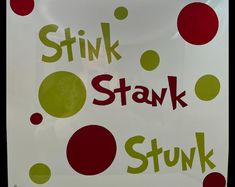 a sign that says stink stak stuk with red and green polka dots on it