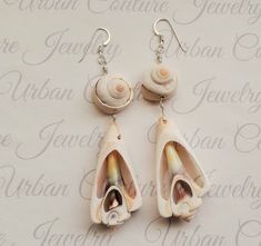 These bohemian style earrings feature large natural sea shells suspended from your choice of gold plated hypoallergenic stainless steel, silver stainless steel, sterling silver, 14k gold filled, 14k rose gold filled or 999 fine silver ear hooks. These earrings also come gift wrapped for free. Jewelry Theme: Ocean Mermaid Earrings Please look here for more sea shell jewelry https://www.etsy.com/shop/UrbanCoutureJewelry?ref=simple-shop-header-name&listing_id=765135936&search_query=sea+shel Bohemian Shell Earrings For Gift, Bohemian Shell-shaped Earrings For Gift, Unique Shell Earrings For Beach, Bohemian Shell Earrings For Jewelry Making, Bohemian Shell-shaped Earrings For Vacation, Bohemian Shell Jewelry For Pierced Ears, Unique Nickel-free Earrings For Beach, Bohemian Adjustable Dangle Shell, Bohemian Shell Earrings Nickel Free