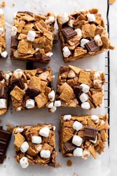 marshmallows and graham crackers are arranged on top of each other in squares