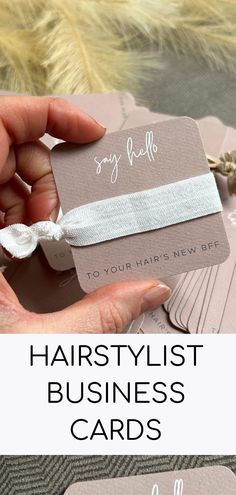 a hand holding a business card with the words hairstylist business cards on it