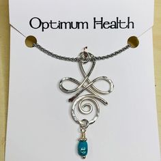 Handcrafted pendant in Sterling Silver wire shaped in the form of the Zibu angelic symbol for "Acceptance of Optimum Health."  Pendant comes with a stainless steel chain 18" with 2" extender. A turquoise bead enhances the energy of the symbol.  Each pendant is infused with love and positive energy from the angels and is accompanied by a card with a channeled inspirational message. Spiritual Nickel-free Turquoise Necklace Gift, Nickel-free Spiritual Turquoise Necklace For Gift, Zibu Symbols, Angelic Symbols, Infused With Love, Optimum Health, Inspirational Message, Dragonflies, Turquoise Beads